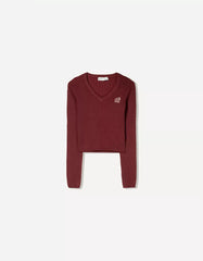 Cable-knit sweater with embroidery