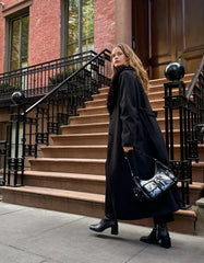 Coat with a detachable faux fur collar