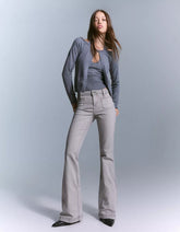 Flared pants with pocket flaps