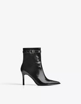 Heeled ankle boot with buckle strap