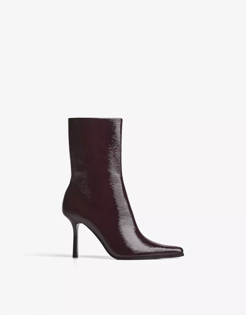 Engraved heel ankle boot