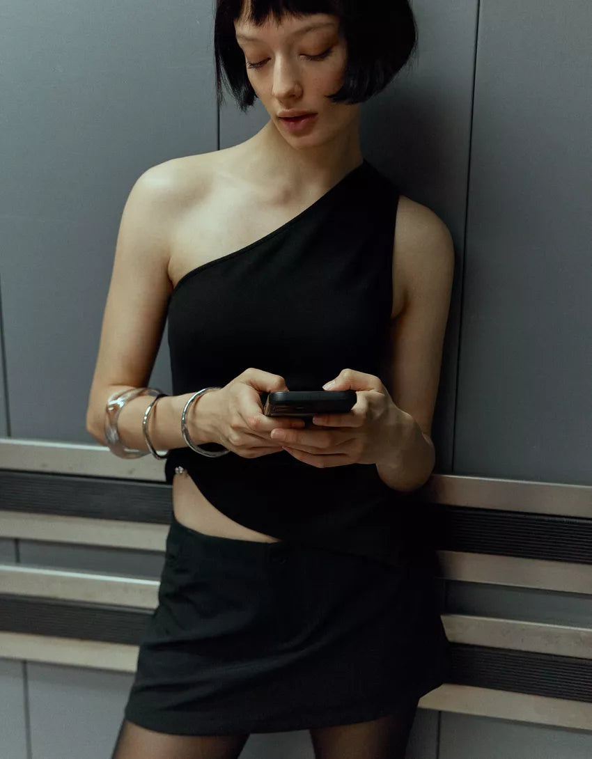 Asymmetric rhinestone top with ring detail