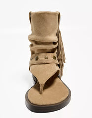 Flat sandals with fringed strap