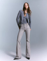 Flared pants with pocket flaps