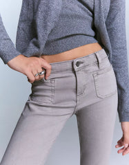 Flared pants with pocket flaps