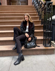 Coat with a detachable faux fur collar